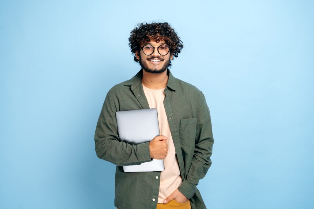 Educator Resources Studend holding laptop smiling Career Guide