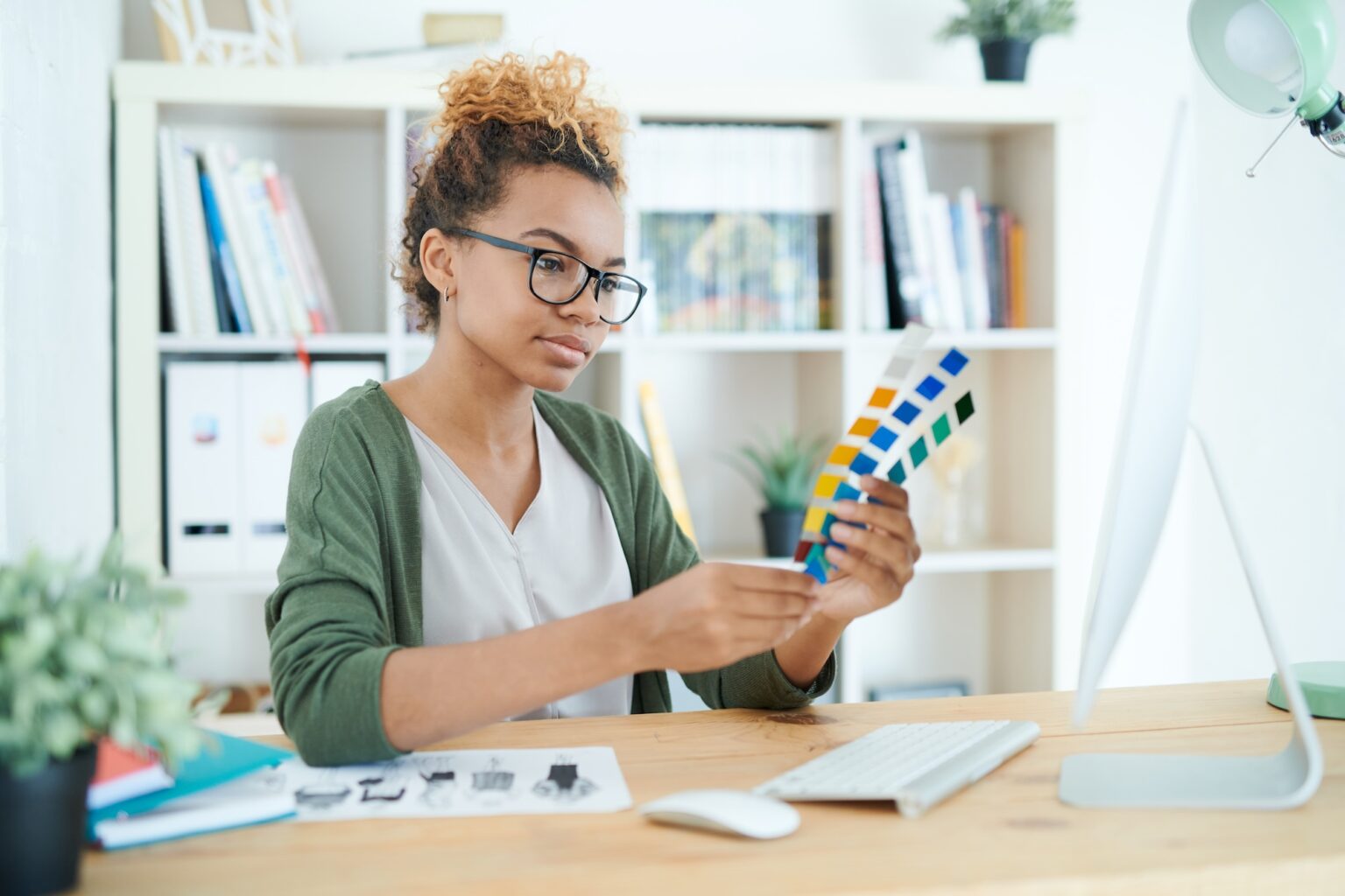 Student looking at color swatches. image for Student Design Contests​ page
