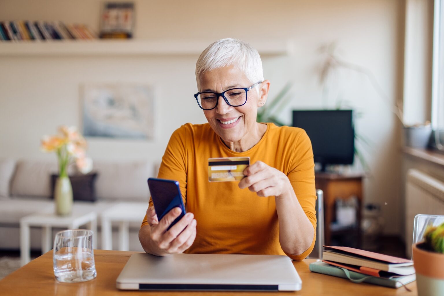 Woman with her credit card looking for ways to give
